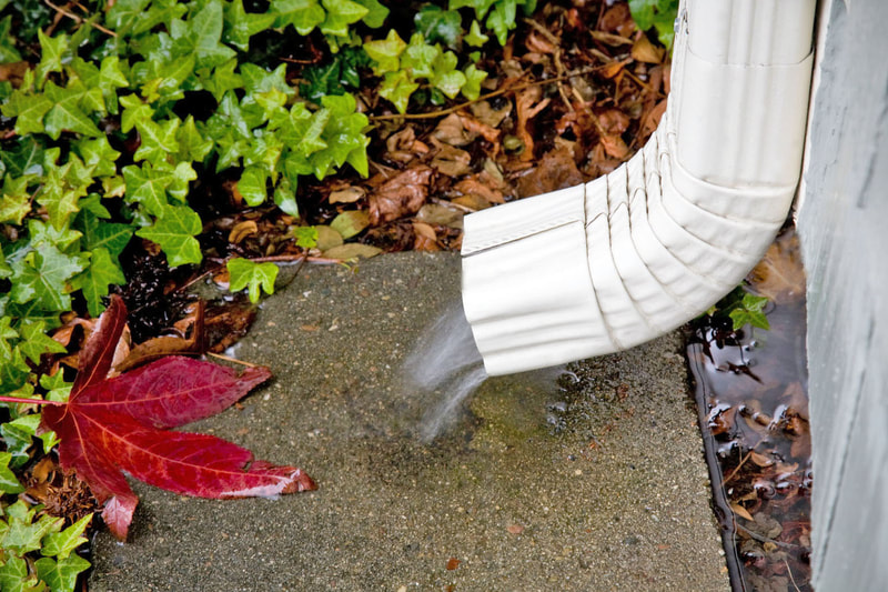 Free flowing water coming out of downspout